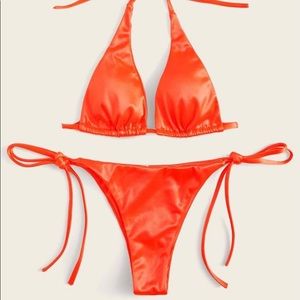 Two piece orange bathing suit.